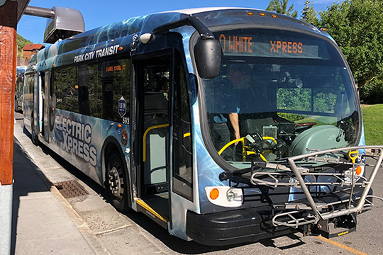 Park City Transit electric bus parks to pick up passengers.