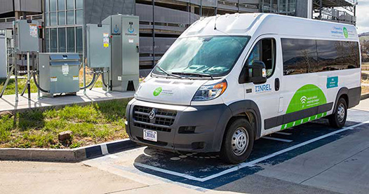 An electric van at a charging station.