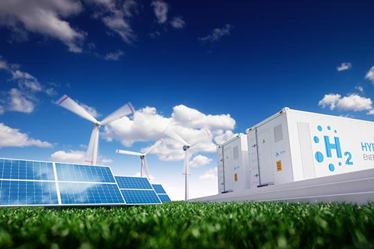 A hydrogen energy storage building next to a solar and wind energy field