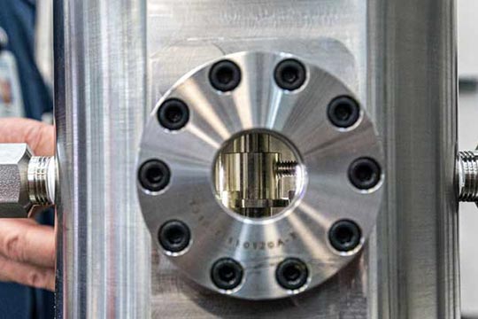 A viewing aperture in a reactor allows researchers to observe internal gas-mixing dynamics.