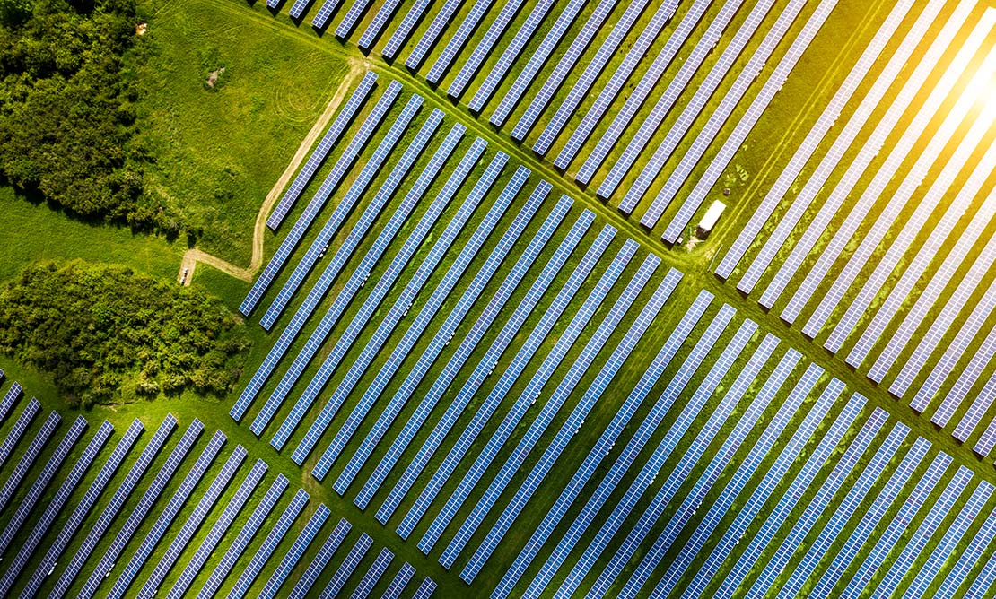 View from above of solar panels in a field.
