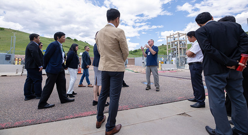 Person gives tour to group at NREL facility.
