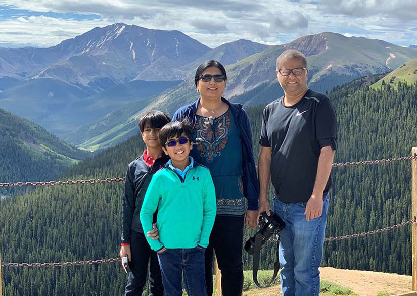 Abhishek Roy and hist family with mountains in the background