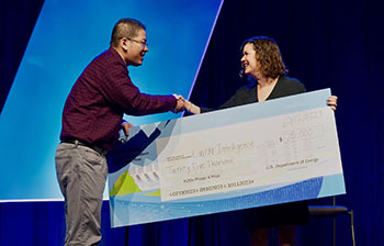 Photo of WPTO Director Jennifer Garson presenting the first place award in the H2Os prize.
