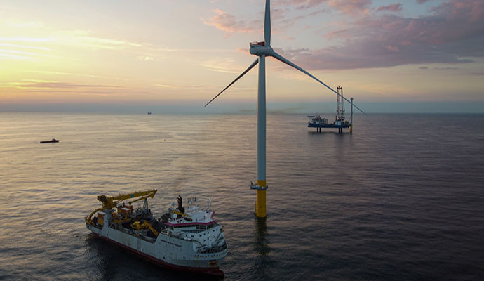 Floating wind turbine at sunset