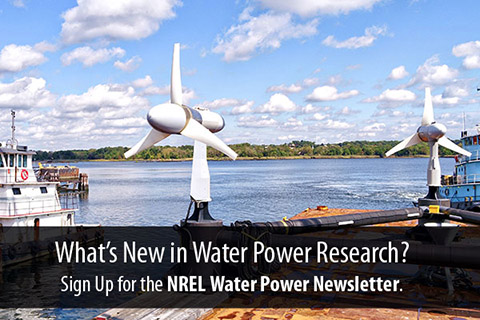 Tidal turbines sit upside-down on a dock overlain with the words "What's New in Water Power Research? Sign Up for the NREL Water Power Newsletter Now" 