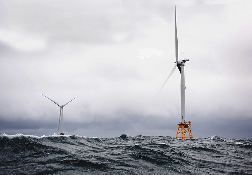 Offshore wind turbines are surrounded by heavy seas.