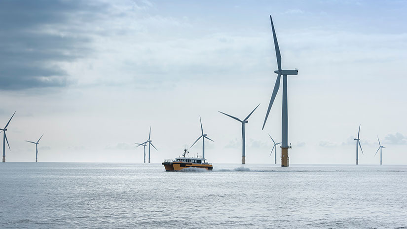 Floating wind turbines in the ocean with a ship