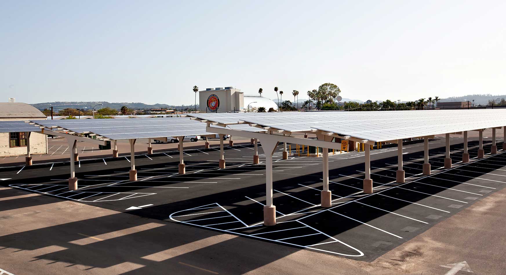 Raised solar panels shade a parking lot