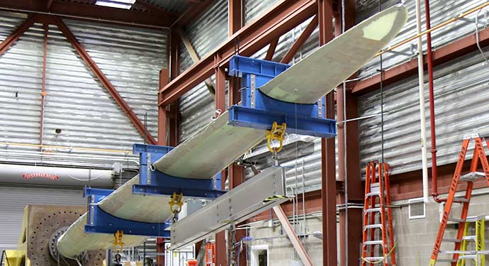A wind turbine blade undergoing testing the NREL's National Wind Technology Center.