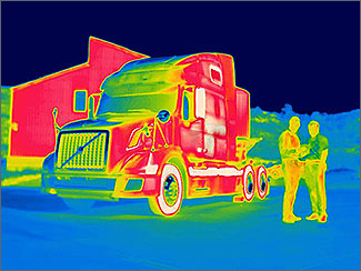 Infrared image of a semi cab and two people.